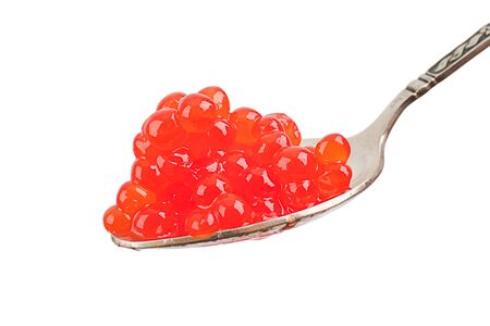 A spoon with red caviar on a silver spoon. Isolated on white backgroundの写真素材
