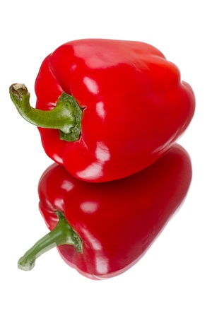 Red bell pepper with reflection isolated on white backgroundの写真素材