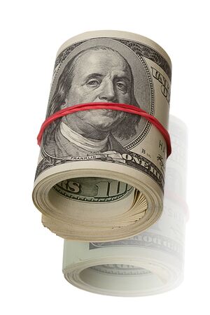 Bundle of dollars tied up with red rubber  Isolated on White backgroundの写真素材