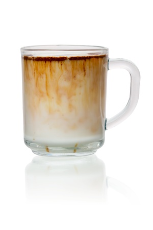 Instant coffee in the milk isolated on white backgroundの写真素材