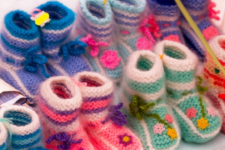 The background of the various knitted baby shoesの写真素材