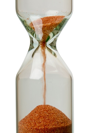 Close-up of an hourglass isolated on white backgroundの写真素材