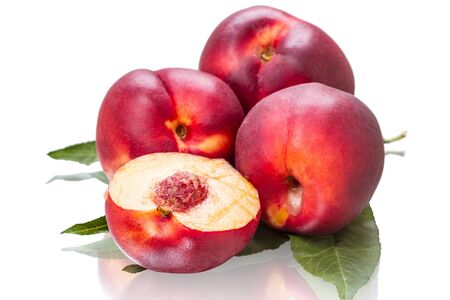 Four ripe nectarines isolated on white backgroundの写真素材