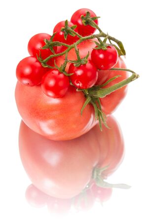 Tomatoes of two varieties - Cherry and Mazarin  Isolated on white backgroundの写真素材