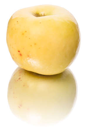 Yellow apple  isolated on a white backgroundの写真素材