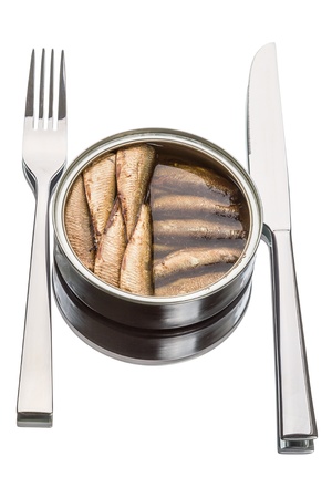 Sprats in a tin can, knife and fork isolated on white backgroundの写真素材