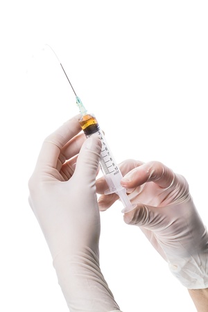 10 ml syringe in doc's hand. Ready to inject. の写真素材