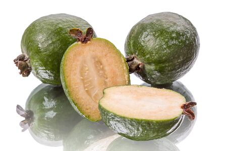 Feijoa and sliced. Isolated on white background with reflectionの写真素材