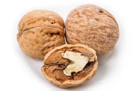Close-up three walnuts on a white backgroundの写真素材