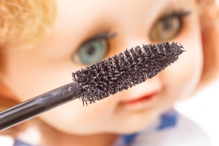 Brush with black mascara and eye dollsの写真素材
