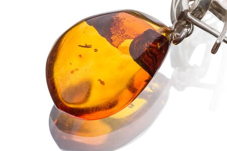 Amber pendant isolated on white backgroundの写真素材