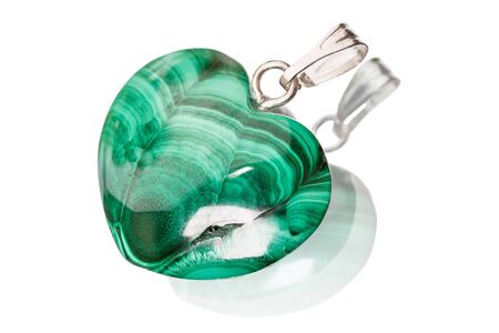Pendant in the shape of a heart from a gemstone malachite isolated on white backgroundの写真素材