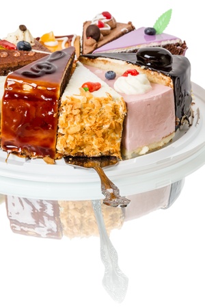 Piece of cake with fruit and metal spoonの写真素材