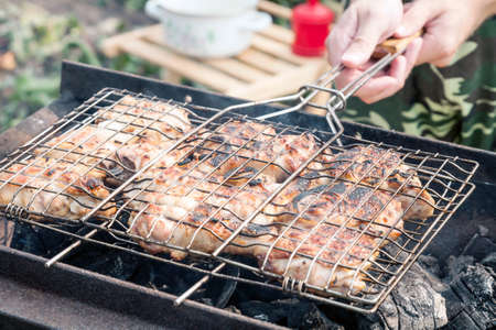 Cooking meat grill on hot charcoalの写真素材