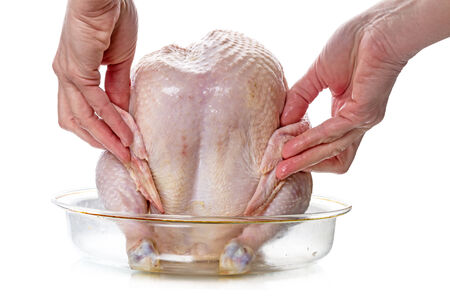 Cooking chicken for grilling in the microwave. の写真素材