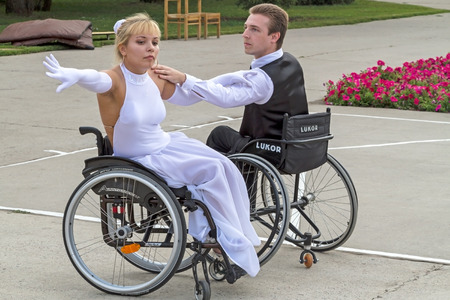 Tambov City, Russian Federation - August 12, 2012   An elegant pair of Valery  and Elena wheelchair dancing  The festival, entitled  People with great potential   Performance in Park Cityのeditorial素材