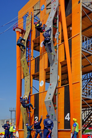 Tambov, Russia - June 16, 2014:  All-Union Competition rescue workers in Tambov. Overcoming Obstacle staff rescue. Sunny summer dayのeditorial素材