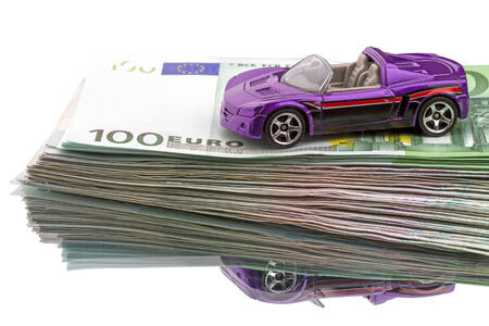 Euro cash to buy a car  isolated on white backgroundの写真素材