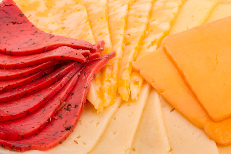 Background of four different varieties of cheeseの写真素材
