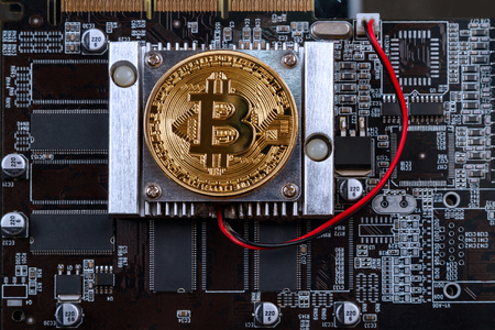 Bitcoin symbol and video card of a personal computerの写真素材