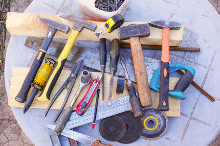 Different old hand-made tools on the table view from the topの写真素材