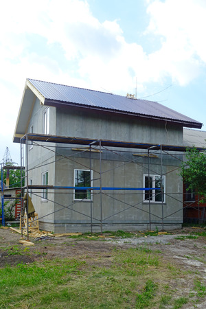 Construction site of a two-story frame house from cement boardの写真素材