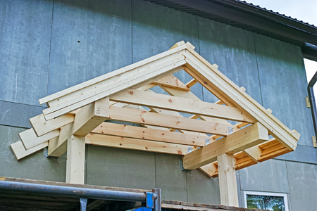 Wooden roof rafters of the porch of the houseの写真素材