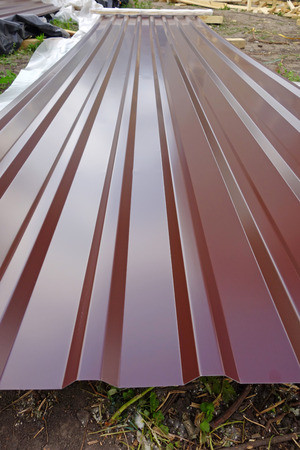 Sheet of chocolate roofing iron. Building your homeの写真素材