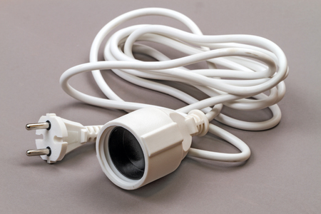 Extension cord for electric wire on a gray backgroundの写真素材