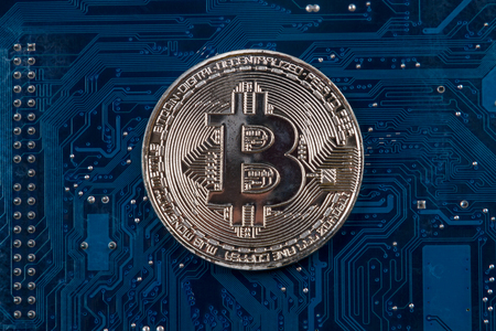Coin Bitcoin on the motherboard. Business backgroundの写真素材
