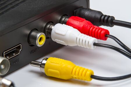 RCA connector used to carry audio and video signals and a television setの写真素材