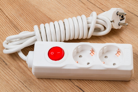 Electrical extension with two sockets and a red switch buttonの写真素材