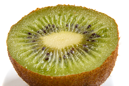 Half Kiwi closeup isolated on white backgroundの写真素材
