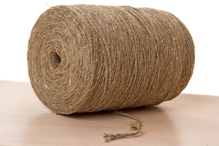 Reel of rope made of flax and hemp on a white backgroundの写真素材