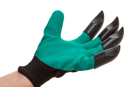 Hand in a garden glove with plastic claws isolated on a white backgroundの写真素材