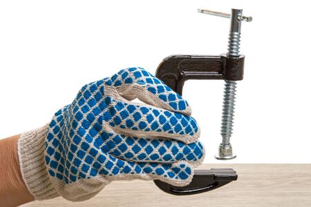 Glove Hand with three-inch clamp for is a fastening device used to hold or secure objects tightly together to prevent movementの写真素材