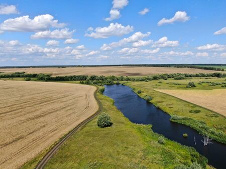 Fields with harvest on a sunny day. View from quadcopterの写真素材