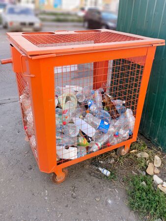 Container for collecting plastic dishes on a city streetの写真素材