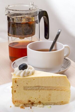 One pieces of souffle cake and a cup of tea
の写真素材