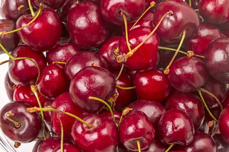 Background of large ripe burgundy cherryの写真素材