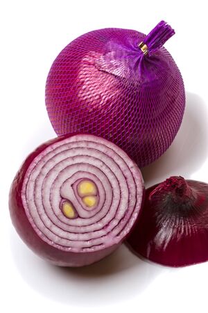 Mesh packaging and red onions isolated on white backgroundの写真素材