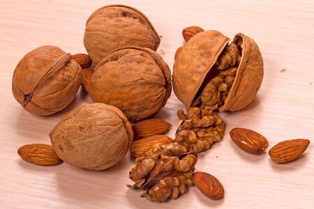 Ripe walnuts and shell on table. Food backgroundの写真素材