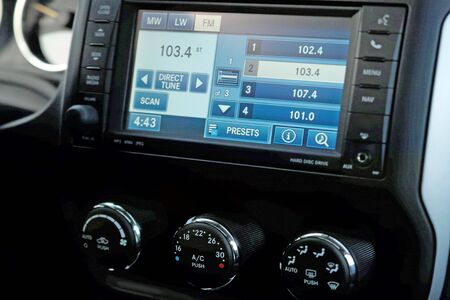 Monitor on the dashboard of the car in FM receiverの写真素材