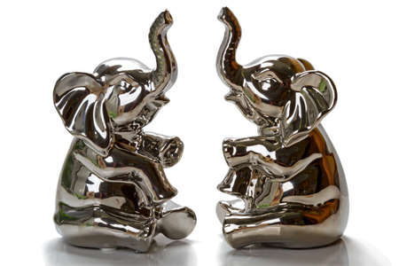 Two glass and mirrored elephants isolated on white backgroundの写真素材