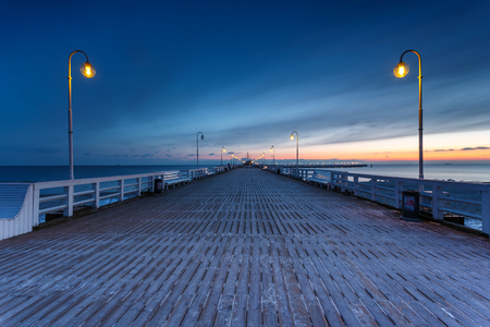Sunrise with amazing colorful sky. Winter in Poland. Cold morning at Pier in Sopot. の写真素材