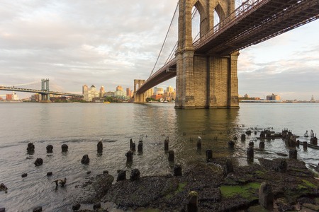 Sunset view of Manhattan Bridge and Brooklyn Bridge, New York, NYC, USAの写真素材