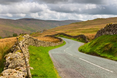 Winding mountain road in The Lake District National Park, Cumbria, England