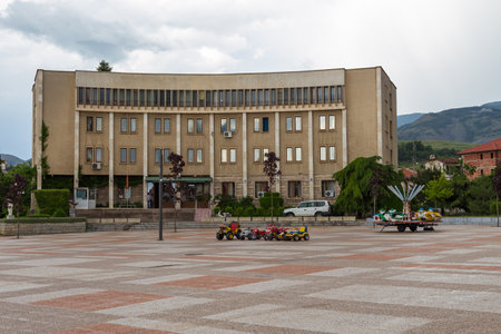 Korce, Albania- 27 June 2014: Street of Korce town in cloudy day. Korce, big town in southeastern Albania surrounded by the Morava Mountains.のeditorial素材