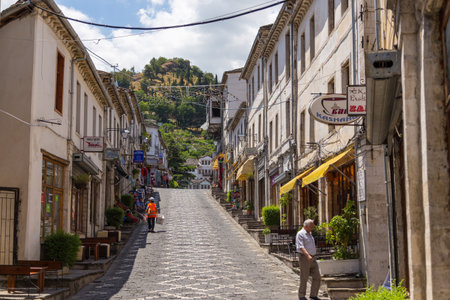 Gjirokaster, Albania- 28 June 2014: View of main street of historic town Gjirokasteron in Gjirokaster. World Heritage Site by UNESCO. Called the city of a thousand stairs.のeditorial素材