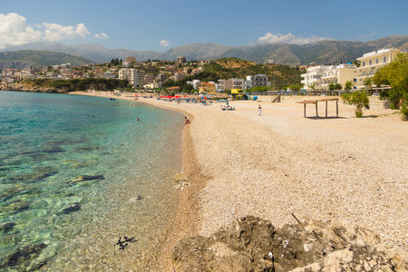 Himare, Albania- 29 June 2014: The coast in the tourist town of Himare. Stony beach on the Adriatic Sea.のeditorial素材